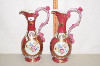 Lot 40 - Pair of gilt decorated ewers