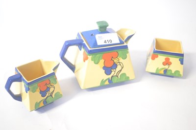 Lot 410 - An Art Deco teapot, small sugar bowl and milk...