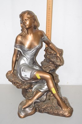 Lot 88 - An Art Deco style figure of a young lady,...