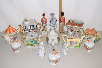 Lot 144 - A collection of various novelty teapots,...
