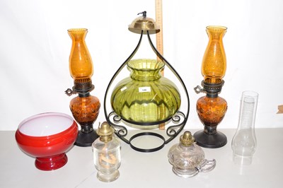 Lot 146 - Pair of amber glass oil lamps, a further...
