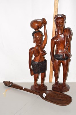 Lot 170 - A pair of African hardwood figures together...