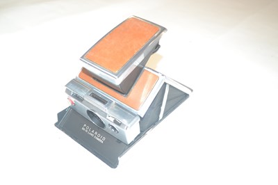 Lot 481 - A Polaroid SX-70 Land Camera, with brown body
