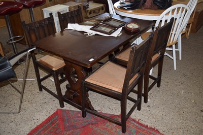 Lot 254 - Small oak dining table and four chairs