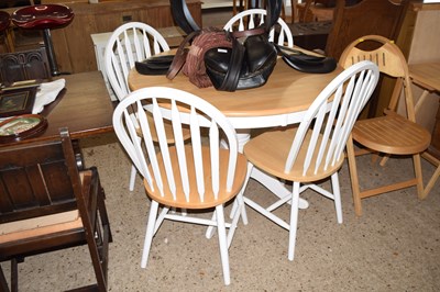 Lot 256 - A modern light wood circular kitchen table and...