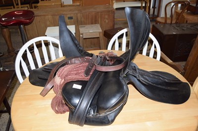 Lot 257 - A leather saddle with associated straps