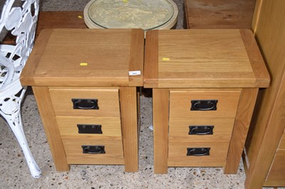 Lot 264 - A pair of modern oak three drawer bedside...