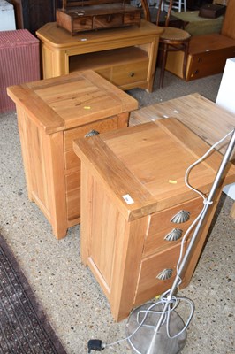 Lot 294 - Pair of light oak three drawer chests