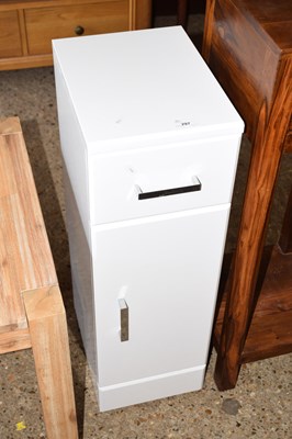 Lot 297 - A light wood narrow bedside cabinet