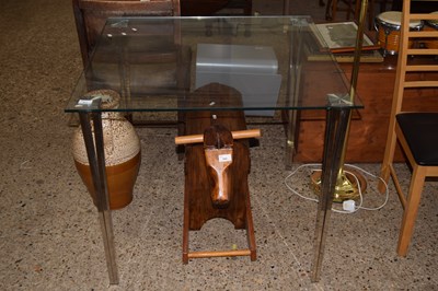 Lot 301 - A glass and steel dining table