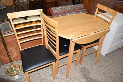 Lot 304 - Modern drop leaf kitchen table and three chairs