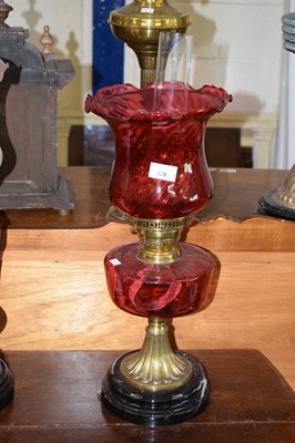 Lot 328 - Early 20th Century oil lamp with red glass...