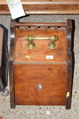 Lot 343 - A Victorian American walnut wedge formed coal box