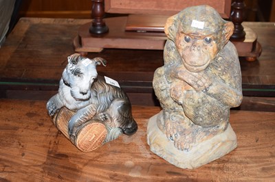 Lot 348 - A pottery monkey and a further model dog (2)