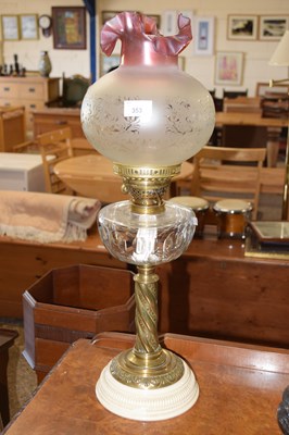 Lot 353 - An oil lamp with frosted glass shade and brass...