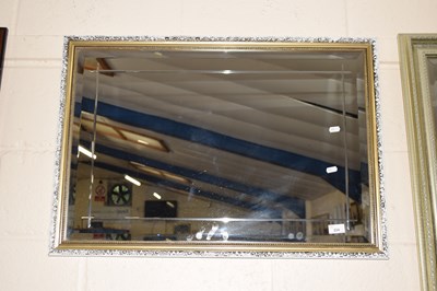 Lot 224 - A modern bevelled wall mirror