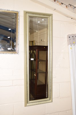 Lot 225 - Modern bevelled wall mirror in a silvered...