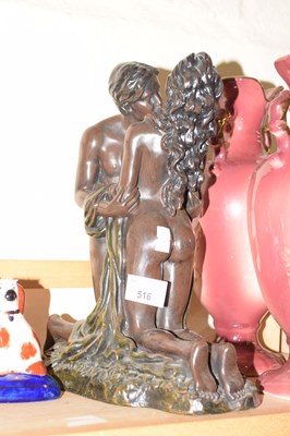 Lot 516 - Resin model of a couple embrassing