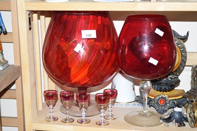 Lot 539 - Two large red glass goblets and a set of...