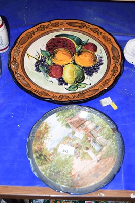 Lot 553 - Pottery fruit decorated charger together with...