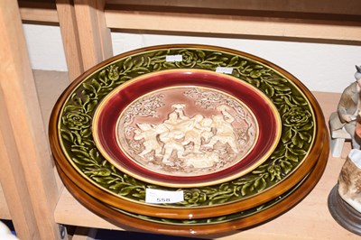 Lot 558 - Two relief moulded pottery plates