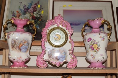 Lot 563 - Pink and gilt glazed mantel clock and a pair...