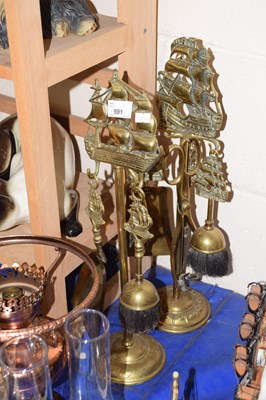 Lot 591 - Two brass fire side companions