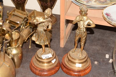 Lot 674 - Pair of brass figurines on turned wooden bases