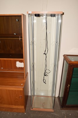 Lot 745 - A small three shelf glass panelled shelving...