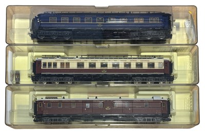Lot 61 - Three cased Trix H0 gauge coaches.