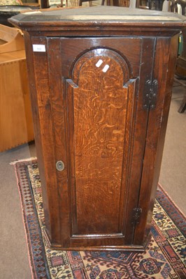 Lot 414 - A George III oak corner cabinet of narrow form...