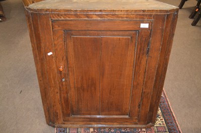 Lot 409 - A George III oak corner cabinet with single...