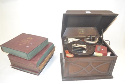 Lot 573 - A vintage HMV oak cased gramophone together...