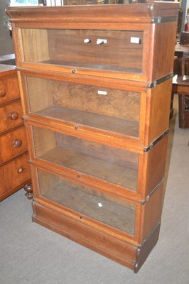 Lot 596 - A Globe Wernicke stacking oak bookcase formed...
