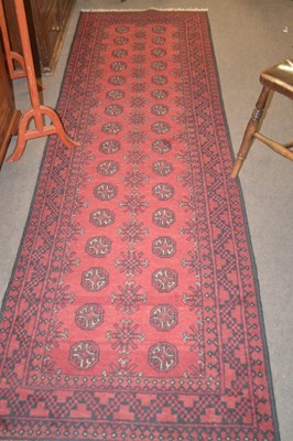 Lot 615 - A 20th Century Afghan runner carpet...