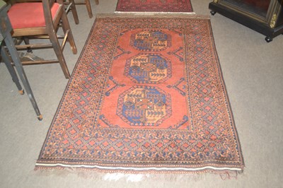 Lot 616 - A 20th Century Afghan wool rug decorated with...