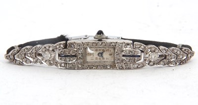 Lot 299 - A precious metal and diamond Art Deco wrist...