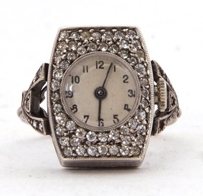Lot 307 - A white metal and marcasite ring watch stamped...