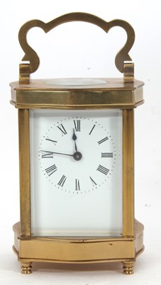 Lot 340 - A four glass brass carriage clock featuring...