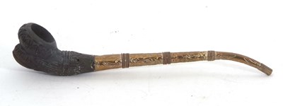 Lot 154A - A 19th Century Burmese clay pipe, the moulded...
