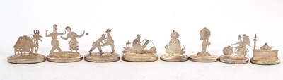 Lot 238 - A group of eight white metal Thi-themed...