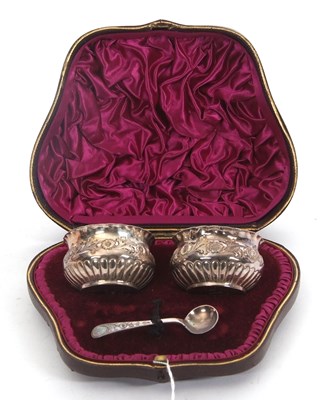 Lot 243 - A cased pair of late Victorian silver salts,...