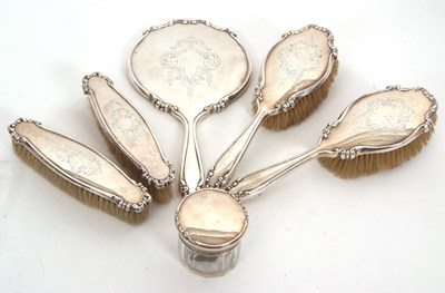 Lot 182 - An Edwardian five piece silver backed dressing...
