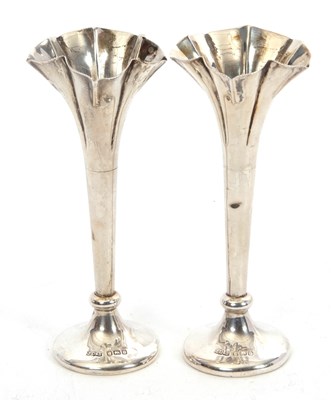 Lot 195 - A pair of Edwardian silver spill vases having...