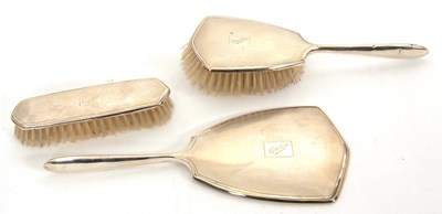 Lot 200 - A three piece silver backed dressing table set,...