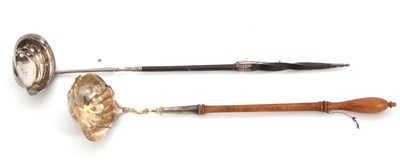Lot 206 - Two Georgian silver toddy ladles to include a...