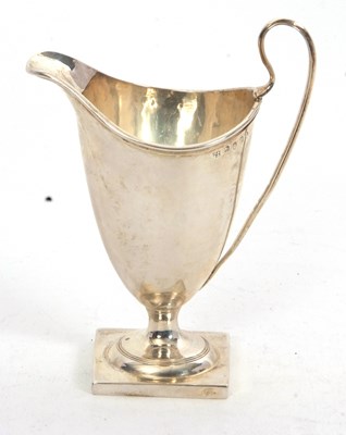 Lot 89 - A George III silver helmet style cream jug on...