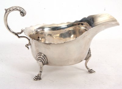 Lot 91 - A George V silver sauce boat of typical form...