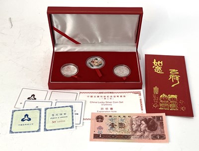Lot 246 - A cased 2007 Chinese 'Lucky' silver coin set,...