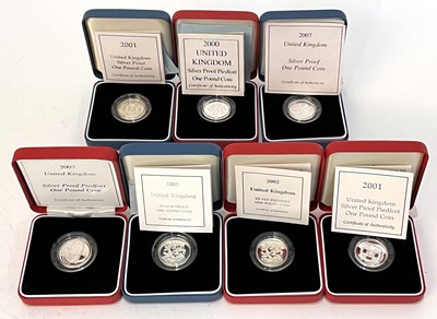 Lot 252 - Seven cased Royal Mint silver proof £1 coins,...